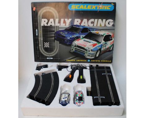 A Scalextric Rally Racing boxed gift set comprising of Subaru Impreza and Toyota Corolla, supplied with a quantity of track a