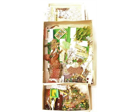 Two boxes containing a quantity of Britains plastic farm and garden accessories to include various flowers, flowerbeds, trees