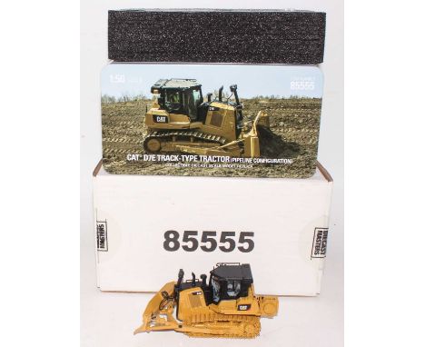 A diecast Masters Real Replicas, Highline Series 1/50 scale diecast model of a Caterpillar D7E track type tractor (pipeline c