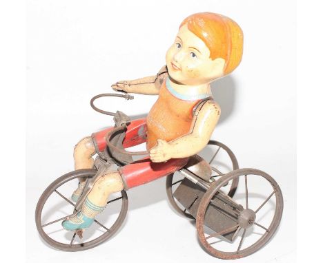 A Marx tinplate and clockwork model of a Wonder Cyclist comprising of Three wheeled trike fitted with clockwork mechanism and