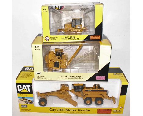 A Norscot 1/50 scale Caterpillar boxed diecast group, three examples to include a Caterpillar D6K XL track type tractor, a Ca