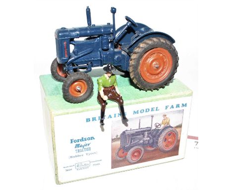 A Britains No. 128F  model farm series Fordson Major Tractor comprising of dark blue body with orange hubs and driver figure,