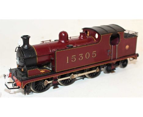 A professionally kit built and hand painted signed Larry Goddard 00 gauge model of a flat iron 0-6-4T locomotive, finished in