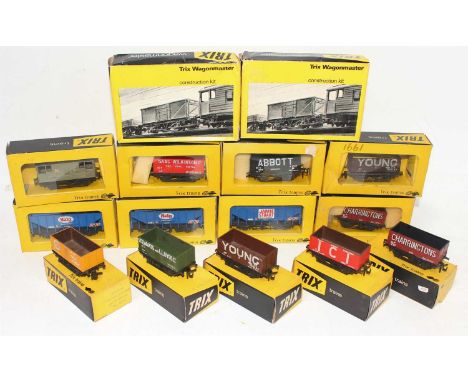 Fifteen Trix wagons in yellow/black boxes: Blue Circle, Spiers, ICI, 2 x Youngs, Stewart &amp; Lloyds, Charringtons, Abbott, 