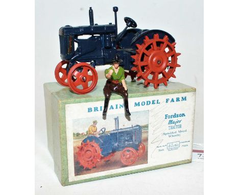 A Britains No. 127F model farm series diecast model of a Fordson Major tractor fitted with spudded wheels, housed in the orig
