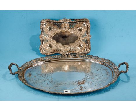A 19TH CENTURY OVAL SILVER PLATED ON COPPER TEA TRAY with serpent handles, pierced border and chinoiserie engravings, 20 ins 
