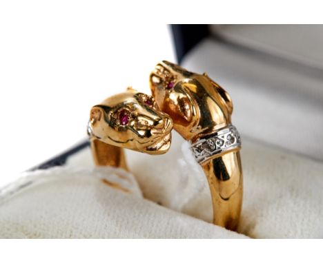 A LADY'S 9CT YELLOW DOUBLE PANTHER HEAD RING, diamond set collars and ruby eyes, size P, approximately 6 grams.   