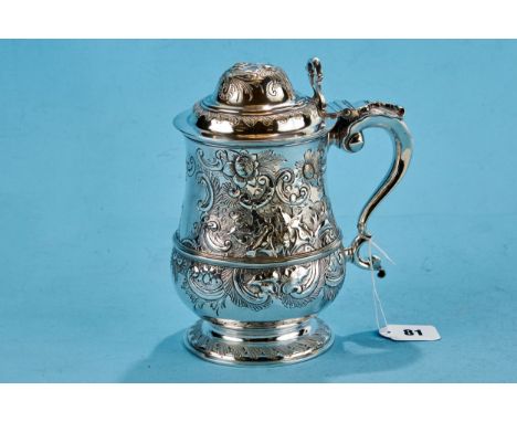 A FINE ELKINGTONS SILVER PLATED 18TH CENTURY STYLE BALUSTER-SHAPED QUART TANKARD AND COVER, gilded interior, foliate embossed