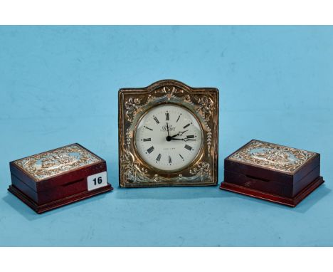 A PAIR OF ELIZABETH II SILVER LIDDED  MAHOGANY FINISH TRINKET BOXES each with embossed cherub head designs, each 4 1/2 ins x 