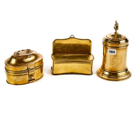 A 19TH CENTURY CYLINDRICAL WEIGHTED BASE BRASS TOBACCO JAR AND COVER with flame finial, 9 1/4 ins high, a ditto shape fronted