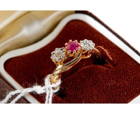 A LADY'S 9CT GOLD RUBY AND DIAMOND RING, size P, approximately 2.6 grams.   