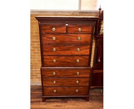 A GEORGE III MAHOGANY CHEST ON CHEST, the dentil cornice above a fluted frieze, two short and three long drawers flanked by c