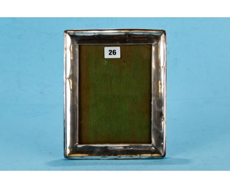 A GEORGE V RECTANGULAR SILVER PHOTOGRAPH FRAME of plain design, oak backed, Birmingham 1922, approximately 10 ins x 8 ins.   