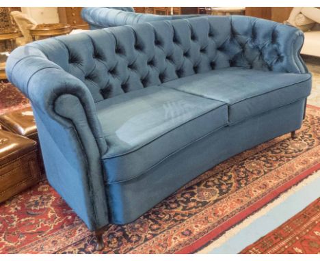 SOFA, in button back blue velvet with concave seat and cabriole supports, 195cm x 92cm x 94cm H. 