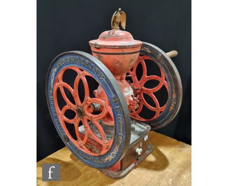 A 19th Century American double fly wheel coffee grinder by Enterprise MFG Co Philadelphia, cast iron hopper mounted with an e