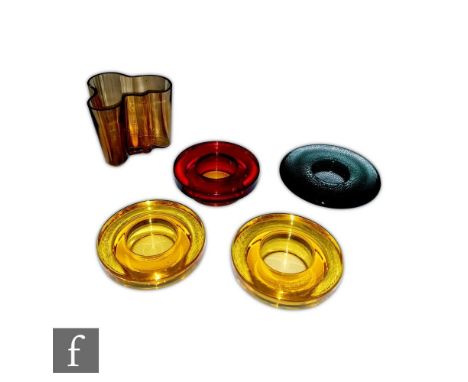 Three Iittala Halo range tealight holders by Harri Koskinen, of stepped cylindrical form, two in yellow and one ruby, moulded