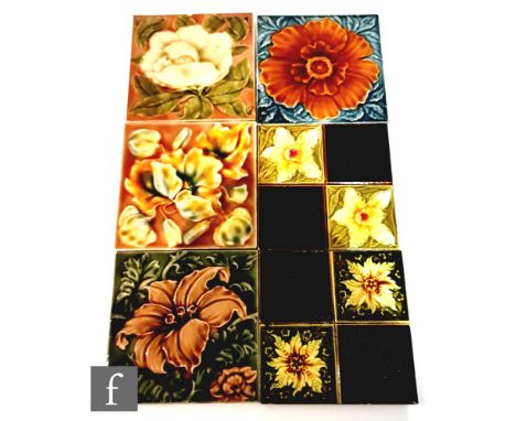 Six assorted early 20th Century Art Nouveau 6in dust pressed tiles with raised floral decorationm to include Mintons China Wo
