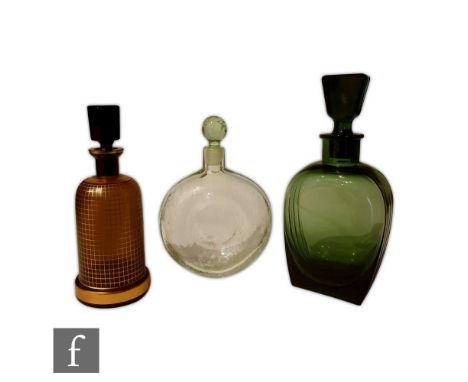 A 1930s Art Deco decanter of footed shouldered form decorated with a gold gilded grid pattern on a satin cinnamon ground toge