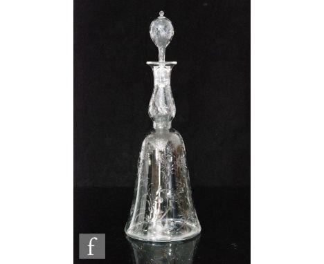 A late 19th Century decanter of bell form, possibly Stevens and Williams, intaglio cut and polished with scrolling foliage an