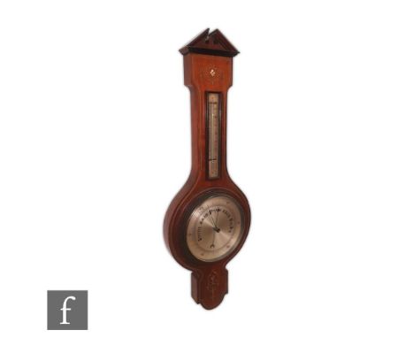 An early 20th century inlaid mahogany aneroid barometer incorporating a thermometer, decorated with pewter and mother of pear