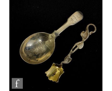 An early Victorian salt spoon, Birmingham, David Pettifer, 1852, length 9cm, together with an engraved caddy spoon, London, J