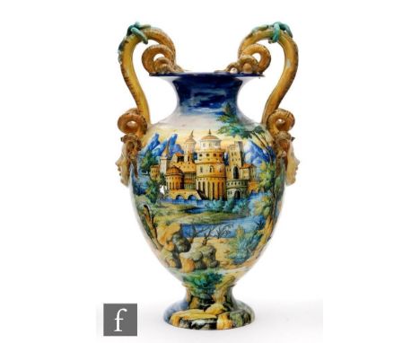 A late 19th to early 20th Century Cantagalli faience vase, decorated in the round with a hand painted Italianate landscape wi