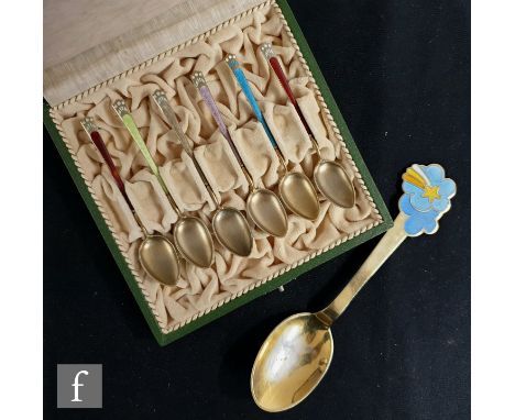 A cased set of six Norwegian silver gilt and enamelled decorated teaspoons each with a differing coloured enamel decoration, 