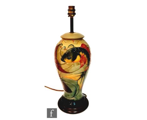 A Moorcroft Pottery table lamp decorated in the Carp pattern designed by Sally Tuffin, marks obscured by affixed wooden plint