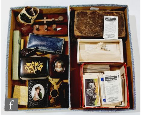 Two 19th century miniature painted porcelain panels, a snuff box, a morse code key, a leaf decorated purse, cigarette cards, 