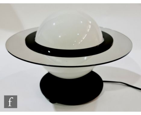 A table lamp in the Art Deco style, formed as Saturn, with an opaque glass shade surrounded by a black acrylic and mirrored r