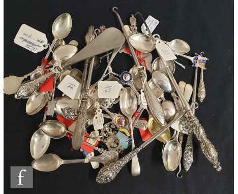 A parcel lot of assorted hallmarked silver teaspoons, silver handled button hooks and shoe horns, various styles and dates. (