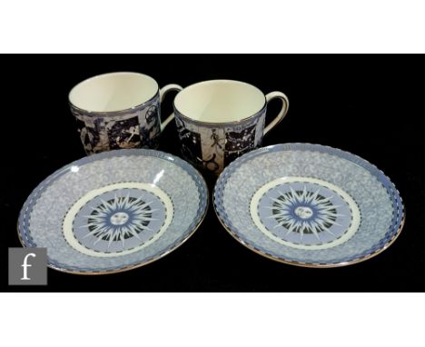 A boxed set of two Wedgwood Millennium Collection cups and saucers decorated with historical events of the 21st Century, agai
