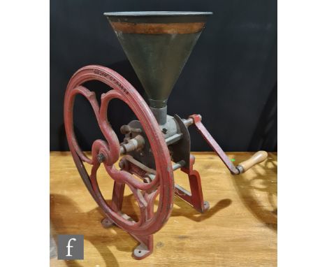 A late 19th century coffee grinder by Parnall &amp; Sons London and Bristol, green painted hopper and red cast iron stand, na
