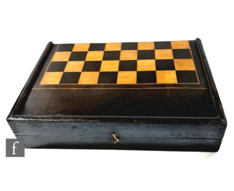 A large 19th Century ebonised boxwood folding chess board, the hinged cover revealing a later felt line backgammon interior, 