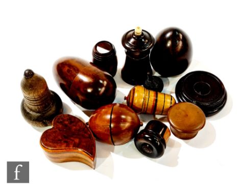 A 19th century lignum vitae taper holder, nutmeg cases, patch boxes, one of heart shaped form etc. (11) 
