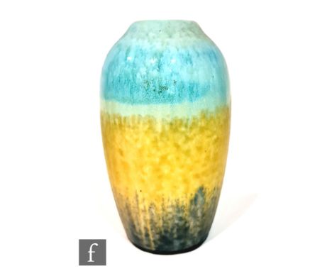 A Ruskin Pottery crystalline vase of swollen form decorated in blue to dark yellow to dark blue with slight crystalline fleck