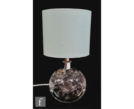 A Webb Corbett clear crystal lamp in pattern no. 753, of globe form cut with stylised flowers and arches, height excluding fi
