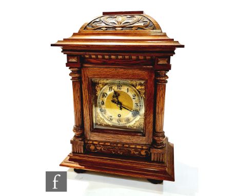 An early 20th century oak cased bracket clock, circular silvered Arabic numerals, the movement striking on a gong, stamped Ke