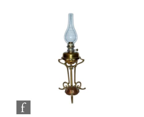 An Edwardian Arts and Crafts style anodized copper table oil lamp by Hinks in the manner of W.A.S. Benson, model 3634, the gl