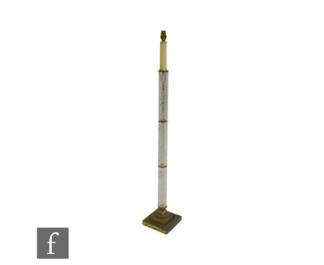 A 1950s/1960s floor lamp, the column formed by three cut and engraved glass cylinders raised to a brass stepped base with an 