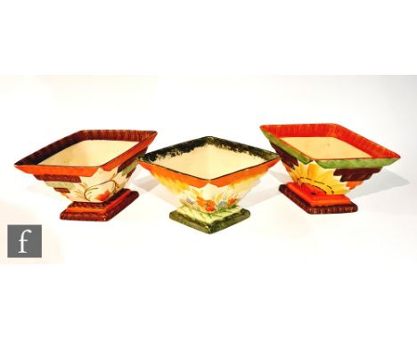 Three 1930s Myott Art Deco diamond shaped planters, the first in the 8514 pattern with orange tulips, the second with a hand 