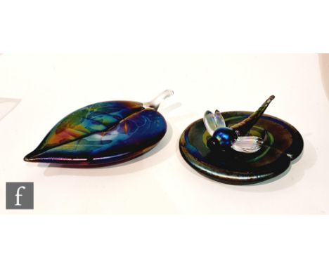Two later 20th Century Lazlo glass paperweights, the first formed as a dragonfly seated on a lily pad, all in a swirling petr