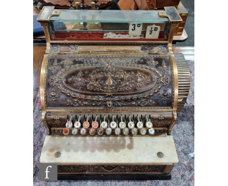 A brass National cash register No S 43 1/4 H, serial no P82406, white marble shelf on ebonised plinth base, width 47cm. 