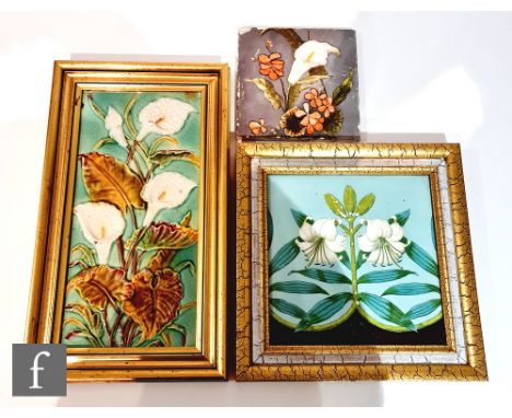A 19th Century framed 8in Mintons Hollins &amp; Co dust pressed tile decorated with a transfer and hand painted lily flower, 