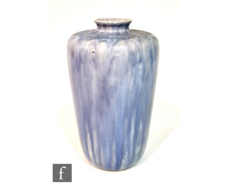 A Ruskin Pottery souffle glazed vase of high shouldered form, decorated in a streaked and mottled tonal blue glaze, impressed