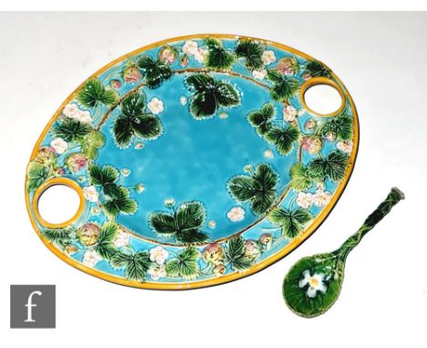 A late 19th Century George Jones &amp; Sons Majolica strawberry dish of oval section, relief moulded with wild strawberry pla