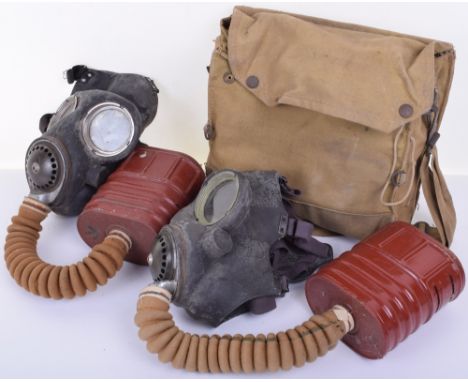WW2 British Army Gas Mask complete with its filter and housed in the original carry case. Accompanied by another gas mask wit