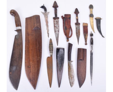 Large Ethnic Style Kukri Knife, housed in wooden scabbard; similar miniature example; 3x North African daggers in leather sca