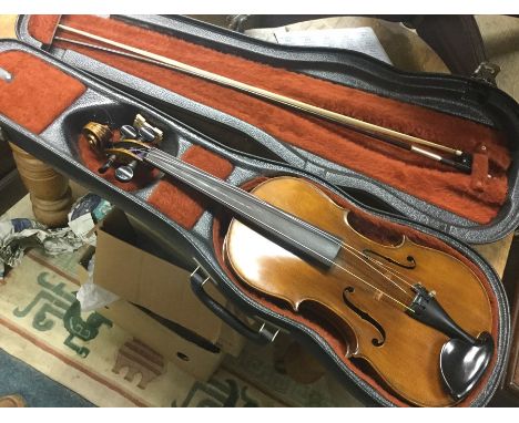 A modern cased violin and bow.