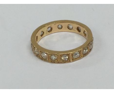 A large rose gold diamond full eternity ring in 18 carat. Approx. 5 grams. Est. £400 - £600.